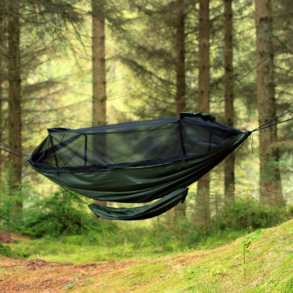DD Gear Sling attached to a hammock in a forest, designed for keeping camping gear off the ground. DD Gear Sling attached to a hammock in a forest, designed for keeping camping gear off the ground.