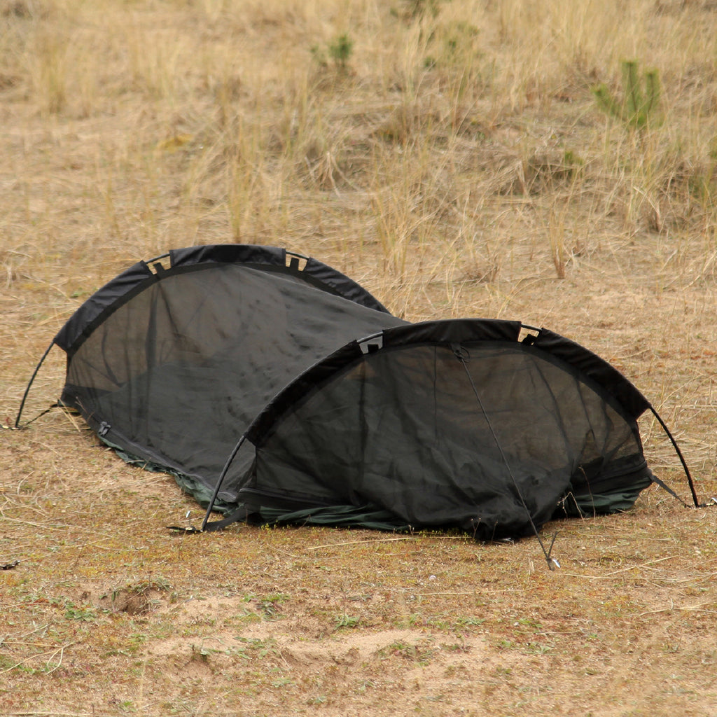 DD Hammocks Superlight Jungle Hammock with mosquito net setup in natural outdoor setting. DD Hammocks Superlight Jungle Hammock with mosquito net setup in natural outdoor setting.