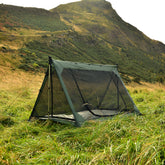 DD Superlight A-Frame Mesh Tent set up in grassy terrain, perfect for camping and backpacking.