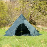 DD Superlight Tipi Tent set up in a grassy area, perfect for camping, hiking, or festivals, by DD Hammocks.