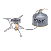 Portable camping stove with Soto fuel canister on a white background