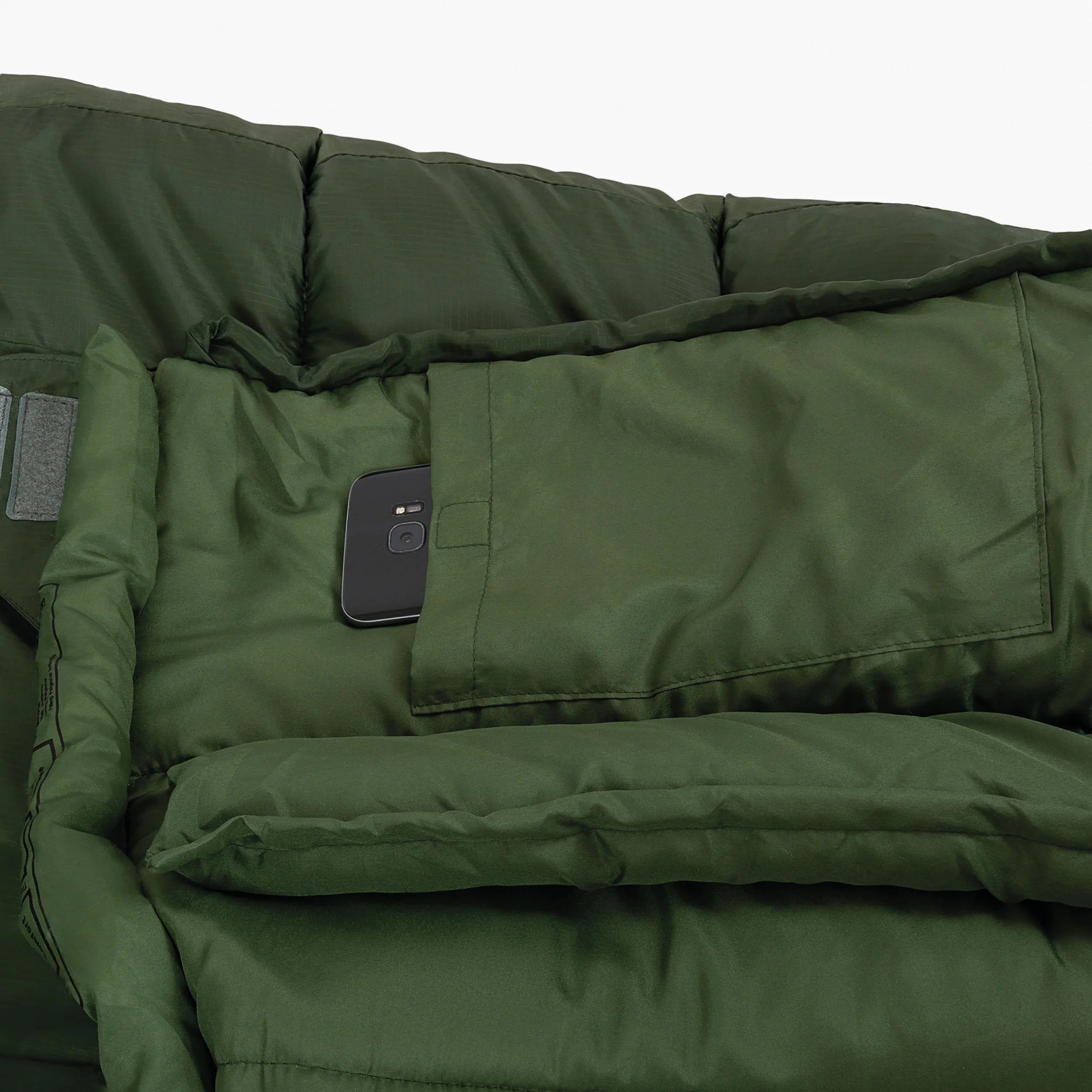 Close-up of the Phoenix Spark 150 mummy sleeping bag featuring a phone pocket for convenient storage. Close-up of the Phoenix Spark 150 mummy sleeping bag featuring a phone pocket for convenient storage.