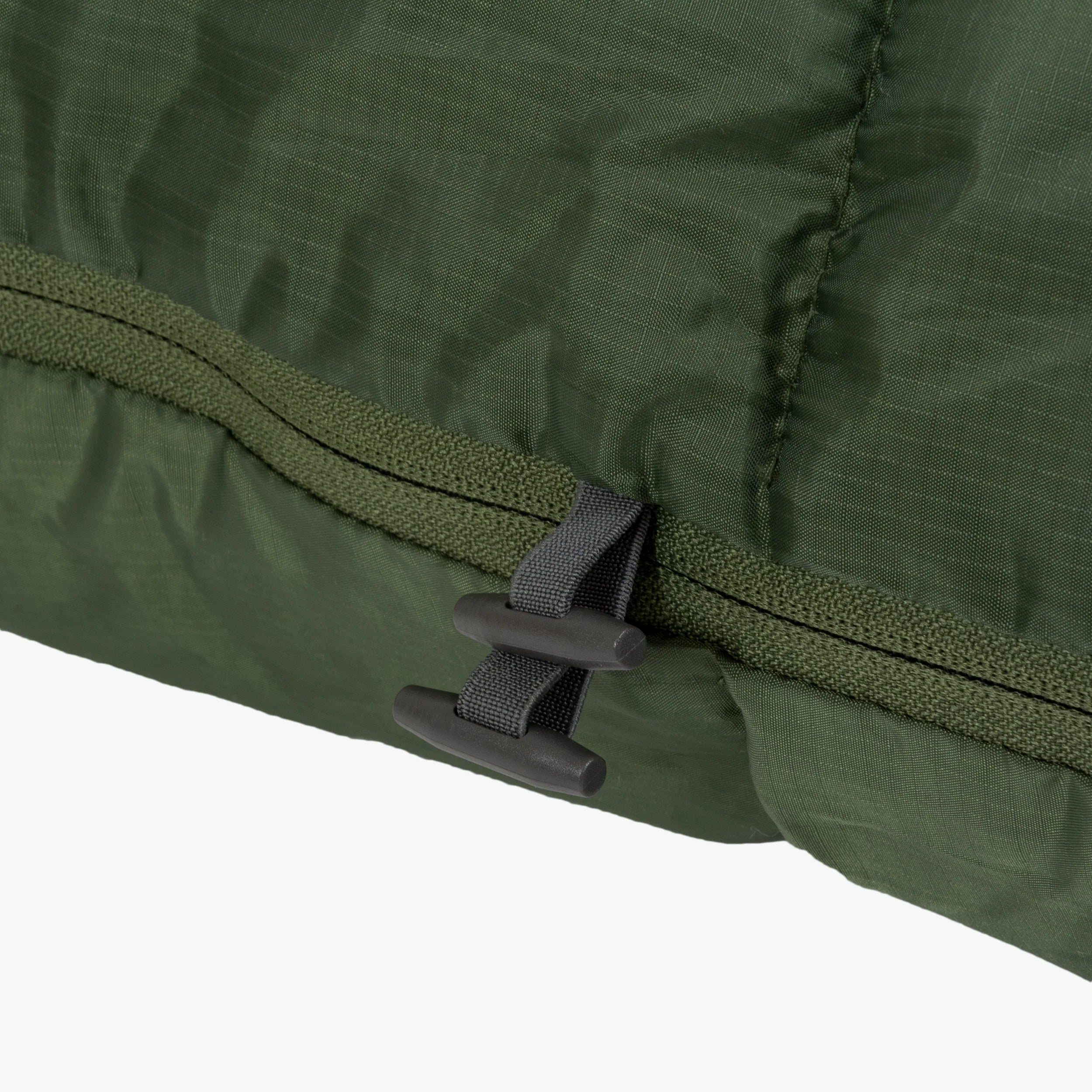 Close-up of the zipper and seam detail on the Phoenix Spark 150 Mummy Sleeping Bag, showcasing its durable construction. Close-up of the zipper and seam detail on the Phoenix Spark 150 Mummy Sleeping Bag, showcasing its durable construction.
