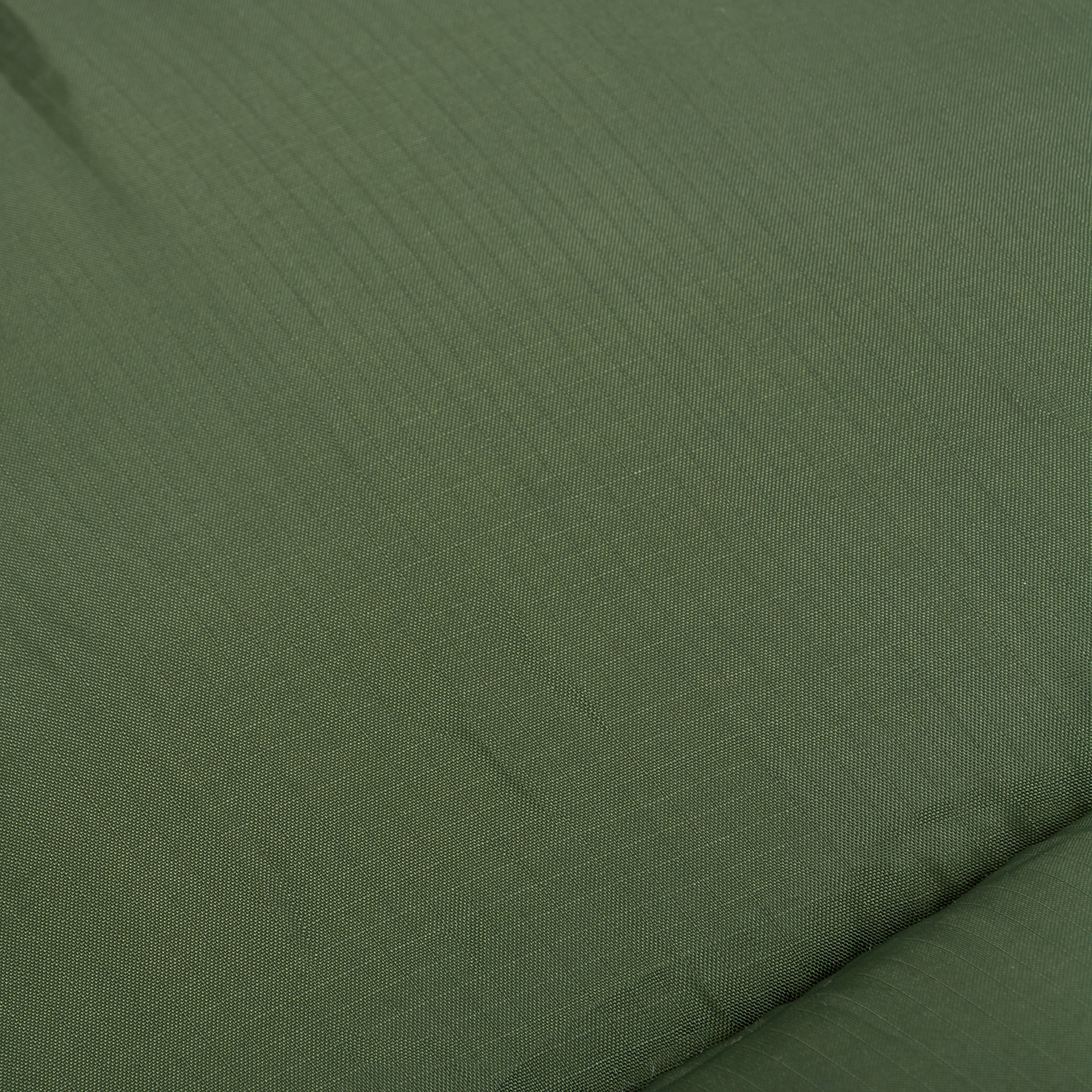 Close-up of the green durable Ripstop fabric of the Phoenix Ember 250 mummy sleeping bag. Close-up of the green durable Ripstop fabric of the Phoenix Ember 250 mummy sleeping bag.