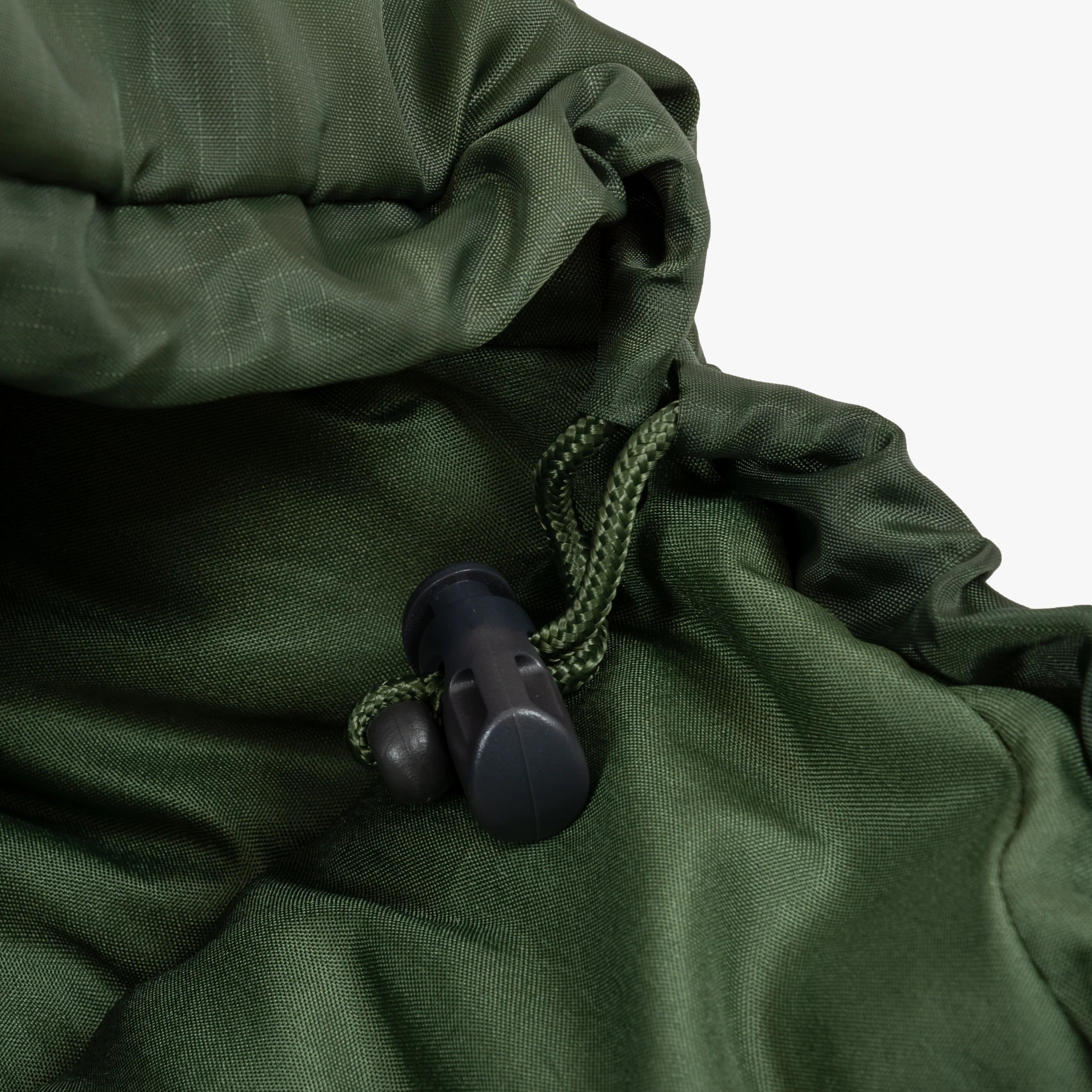 Close-up of the adjustable hood and drawcord on a green mummy sleeping bag. Close-up of the adjustable hood and drawcord on a green mummy sleeping bag.