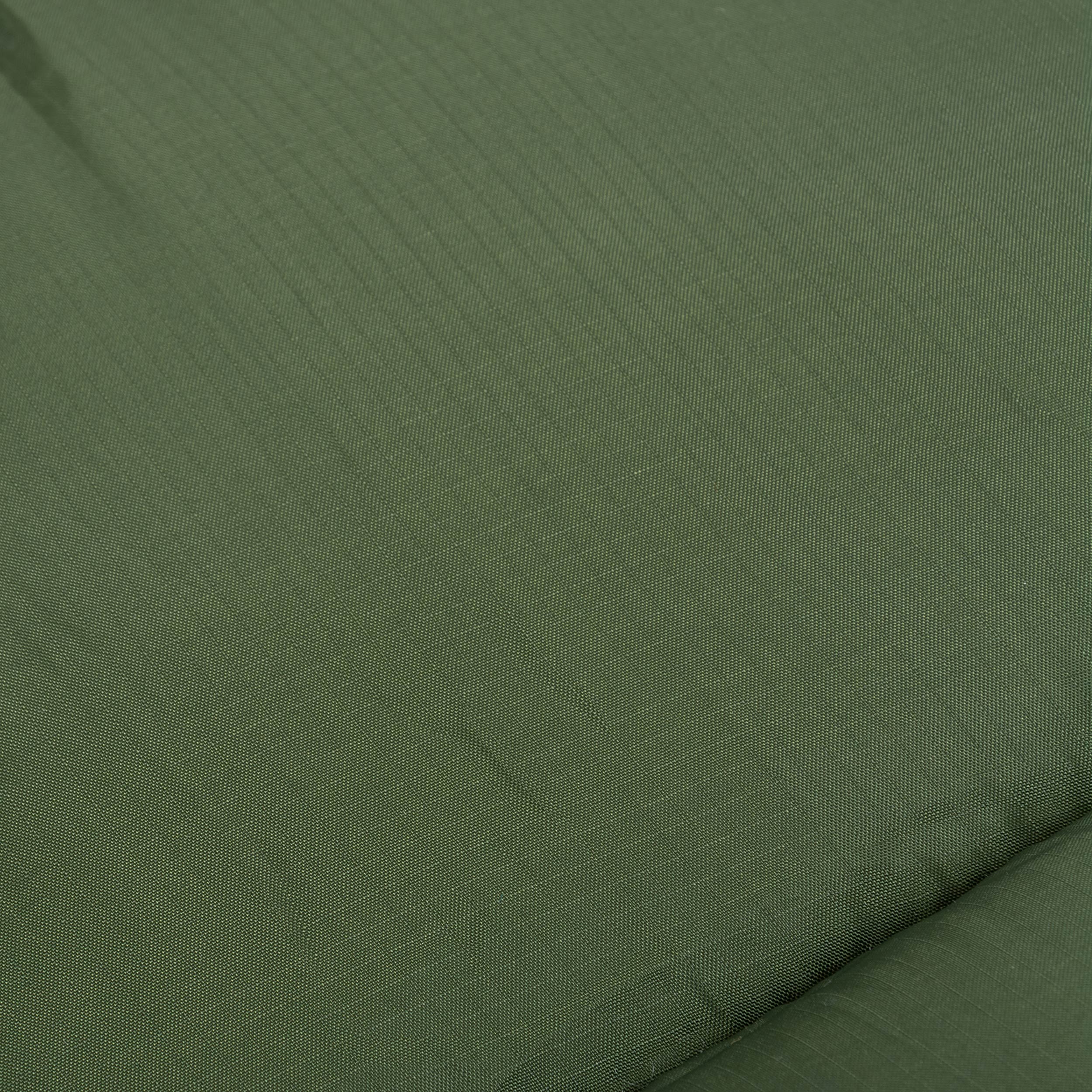 Close-up of the durable ripstop fabric of the Phoenix Flame 400 mummy sleeping bag, ideal for four-season camping. Close-up of the durable ripstop fabric of the Phoenix Flame 400 mummy sleeping bag, ideal for four-season camping.