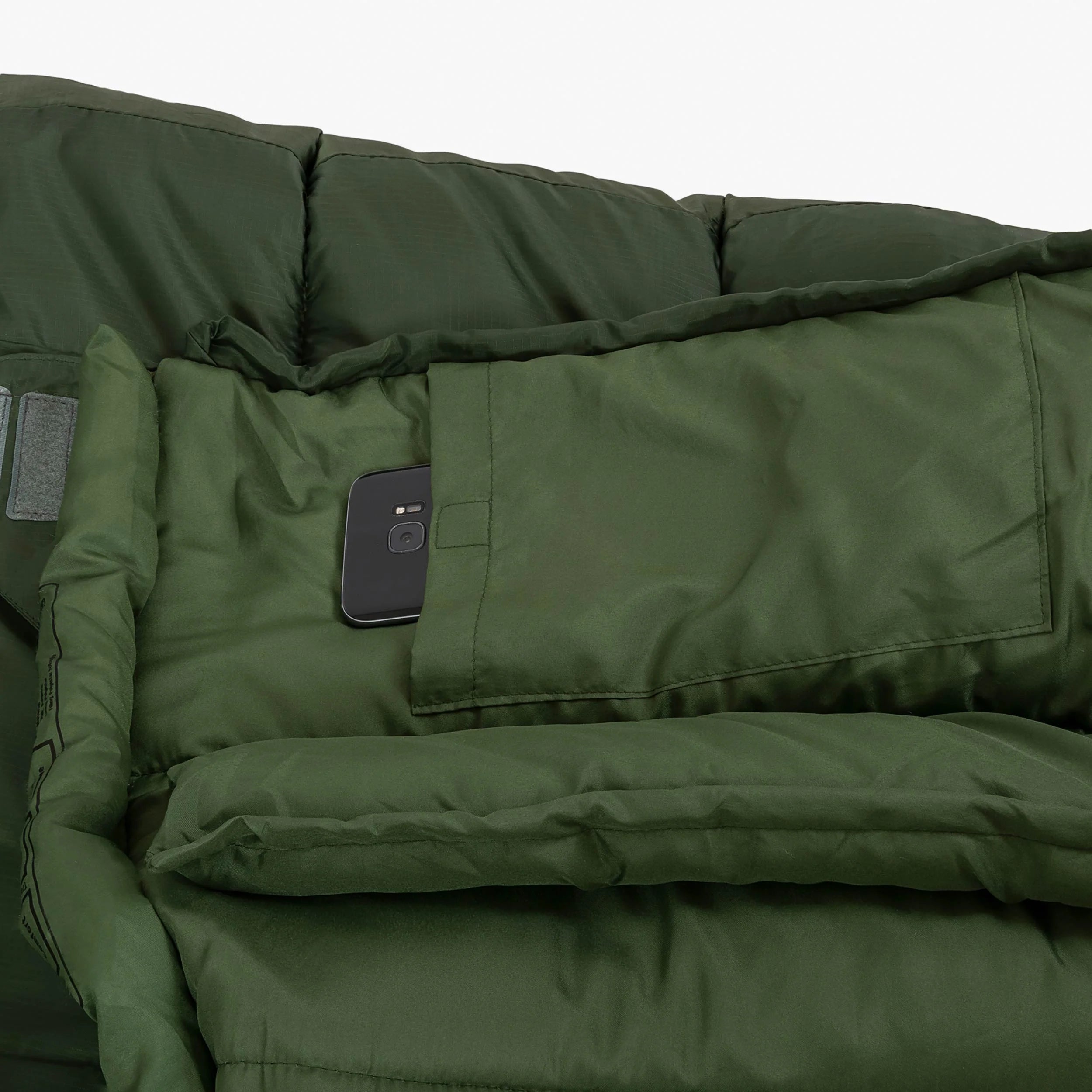 Inner pocket of Phoenix Flame 400 mummy sleeping bag with a smartphone placed inside for convenience. Inner pocket of Phoenix Flame 400 mummy sleeping bag with a smartphone placed inside for convenience.