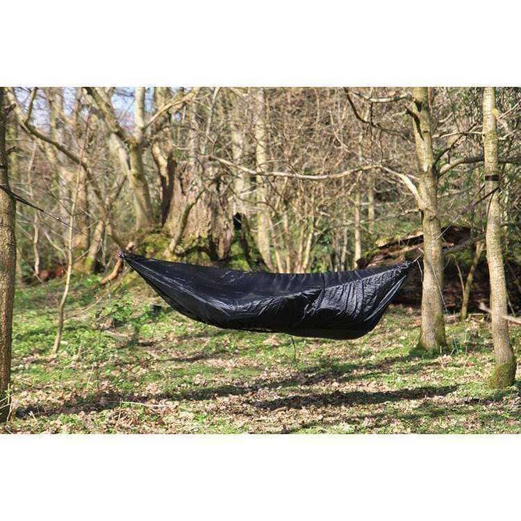 DD Hammocks Superlight Mosquito Net set up in a forest, designed for comfort and protection from insects. DD Hammocks Superlight Mosquito Net set up in a forest, designed for comfort and protection from insects.