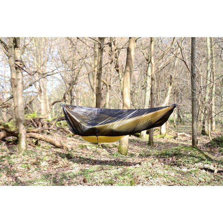 DD Hammocks Superlight Mosquito Net suspended in a forest, designed for comfort and protection. DD Hammocks Superlight Mosquito Net suspended in a forest, designed for comfort and protection.