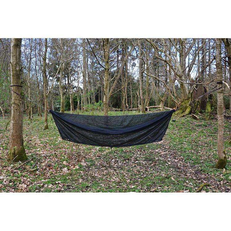 DD Superlight Winter Hammock set up in a serene forest, showcasing its lightweight design for camping. DD Superlight Winter Hammock set up in a serene forest, showcasing its lightweight design for camping.