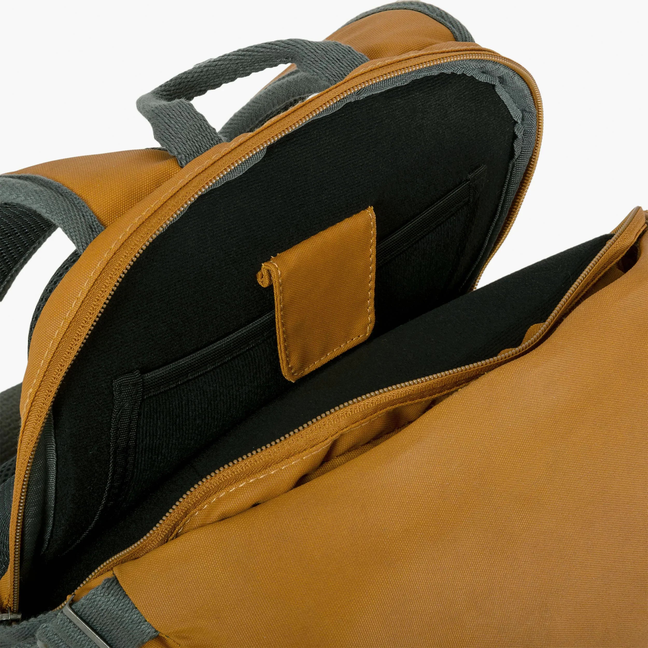 Interior view of the Flug Urban Laptop Backpack showing padded pocket and storage compartments.