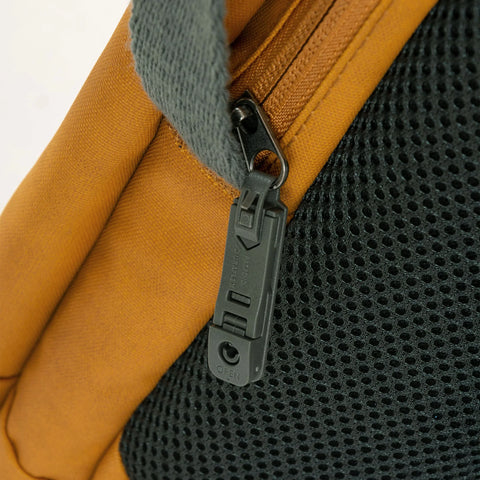 Close-up of the zipper and mesh fabric on the Flug Urban Laptop Backpack, showcasing its stylish design.