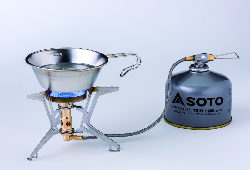Portable gas stove with SOTO brand gas canister on a white background