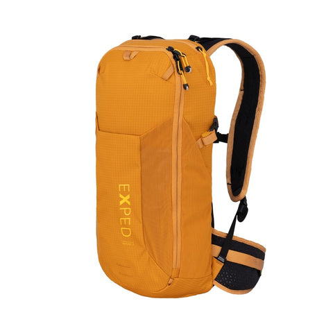 Skyline 12 backpack in vivid orange, designed for light hikes, multisports, and everyday use with ergonomic features.