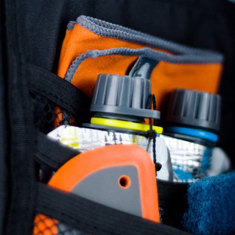 GSI kitchen utensils organized in ballistic nylon travel case showing individual compartments for vehicle camping