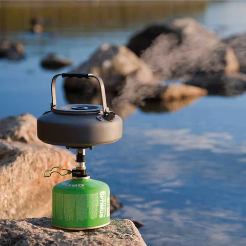 Optimus Terra Camping Kettle Boiling water by the lakeside